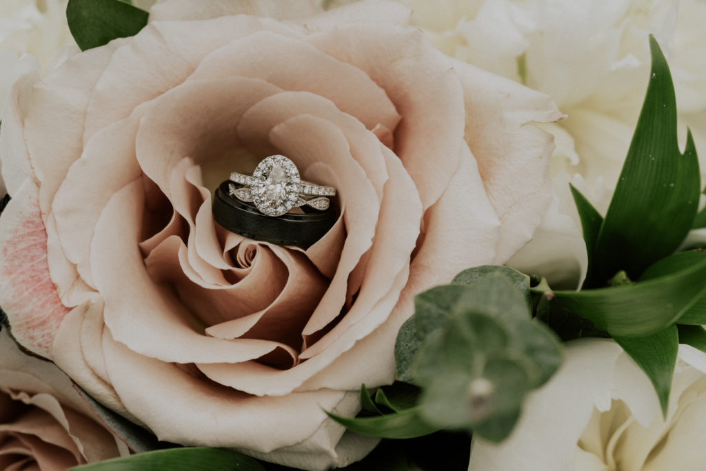 Bride and grooms rings within the bridal bouquet
