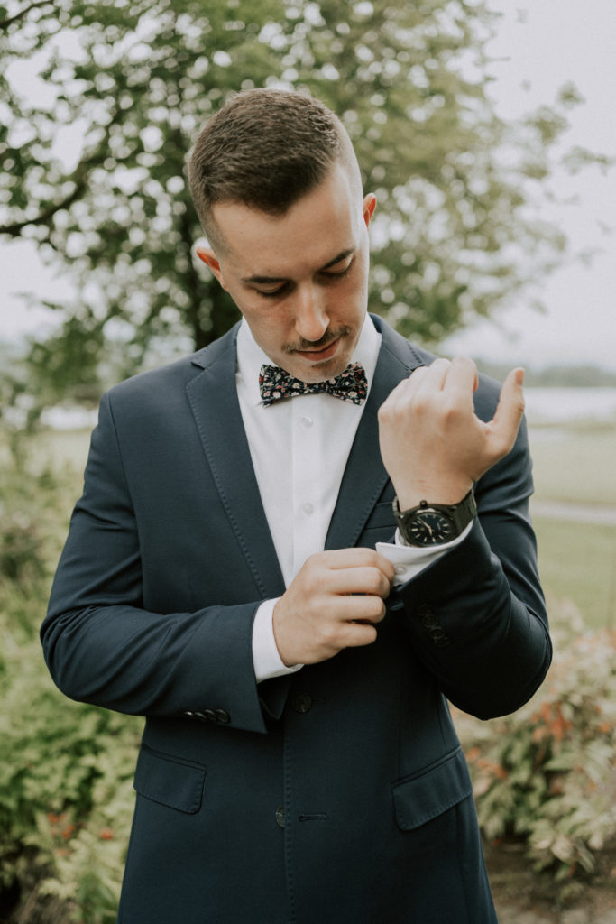 groom fixing watch/suit