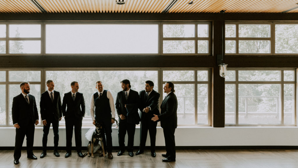 a wedding at furry creek with the groom and groomsmen